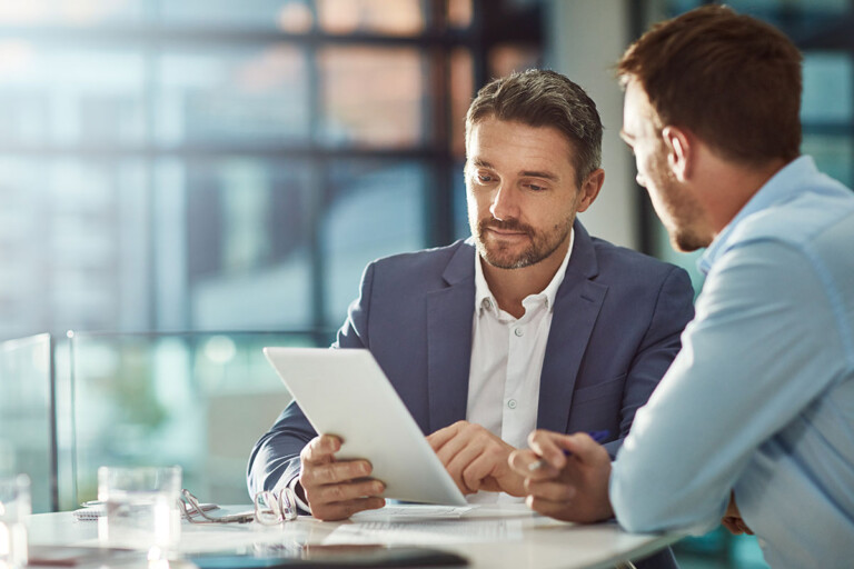 two men discussing technology