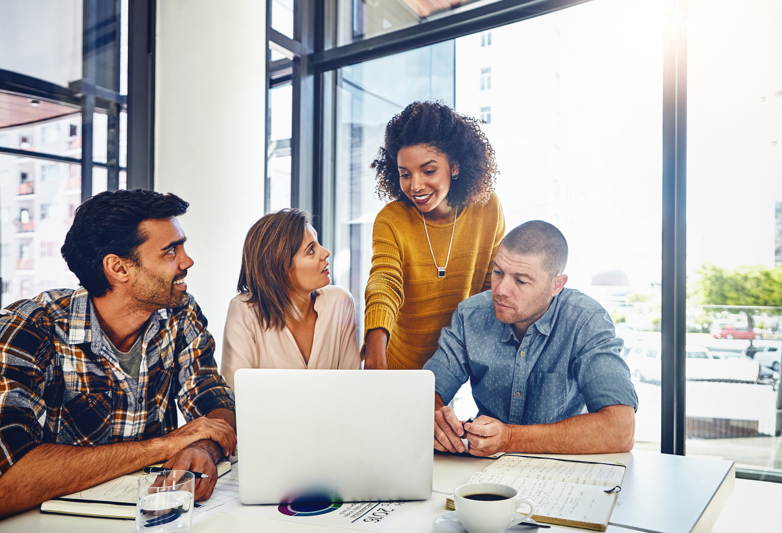 Web designer, planning and team in office with laptop, market research or problem solving in development of project. Website, design and people with technology for online marketing, SEO or strategy