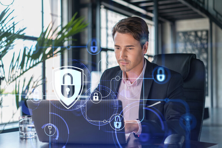 working with laptop to defend customer cyber security