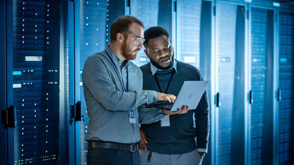 technicians working together in server room
