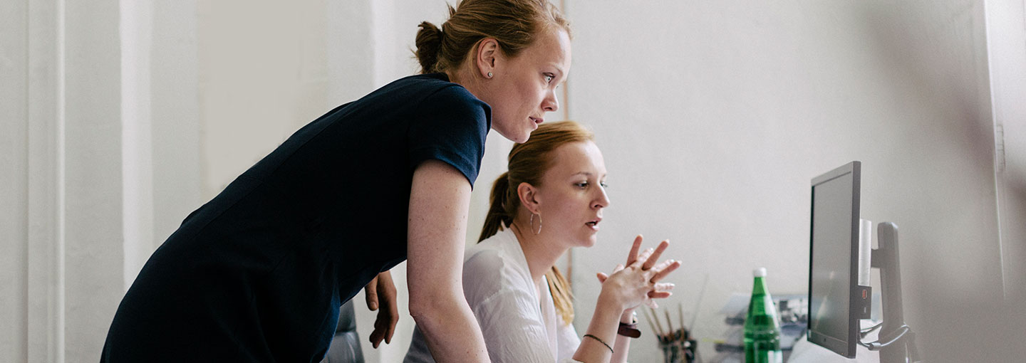 two woman working together